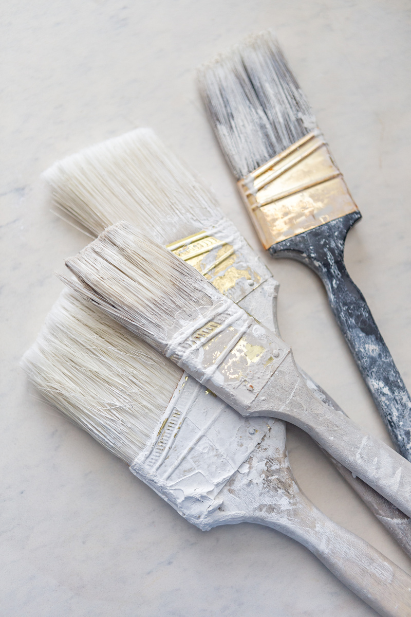 Cleaned Paint Brushes by sink and in water